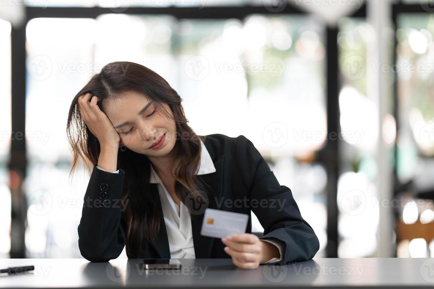 Unhappy young asian female buyer have problems buying online on internet on smartphone with credit card. Angry frustrated woman confused with account money loss shopping on web on cellphone. photo