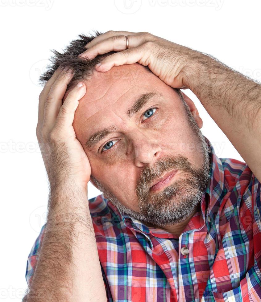 middle age man suffering from a headache photo