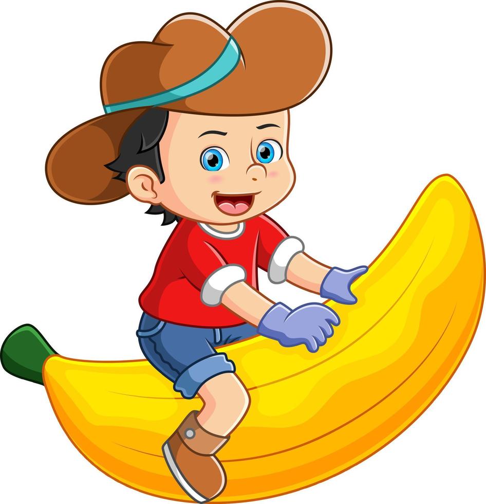A farmer boy happily playing and sitting on a large banana 17775697