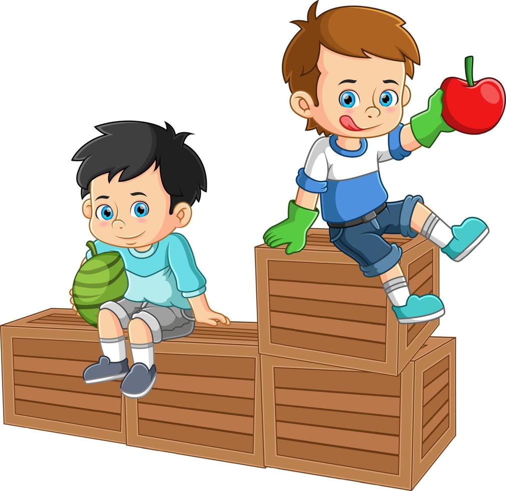 Two boys sitting on top of a fruit crate holding fresh watermelon and apple fruits vector