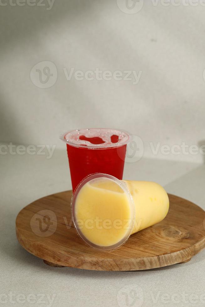 Mango and Water Melon Juice on Sealed Plastic Cup photo