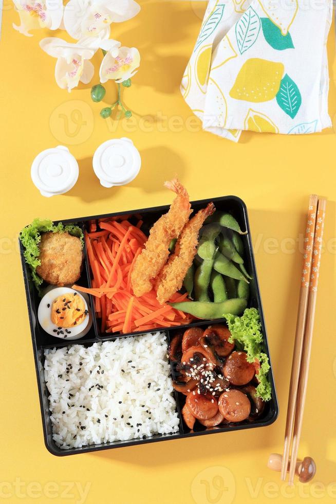 Japanese Bento Lunchbox with Steamed Vegetable, Egg, Nugget photo