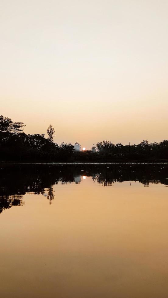 Vertical Sunrise on dal lake, Noakhali Bangladesh photo