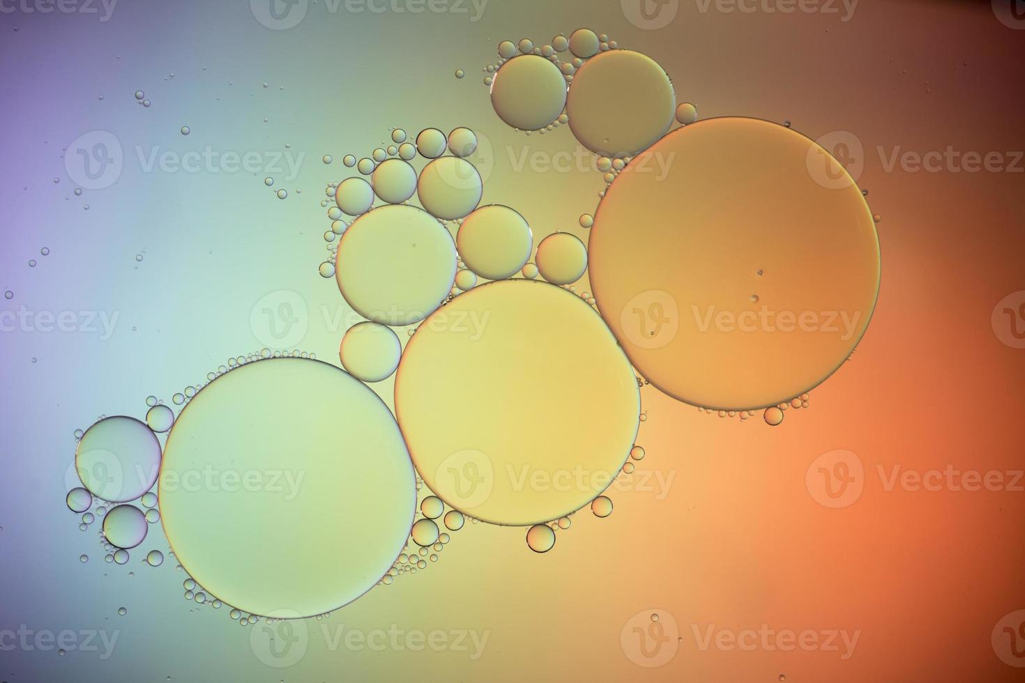 Colorful artistic of oil drop floating on the water photo