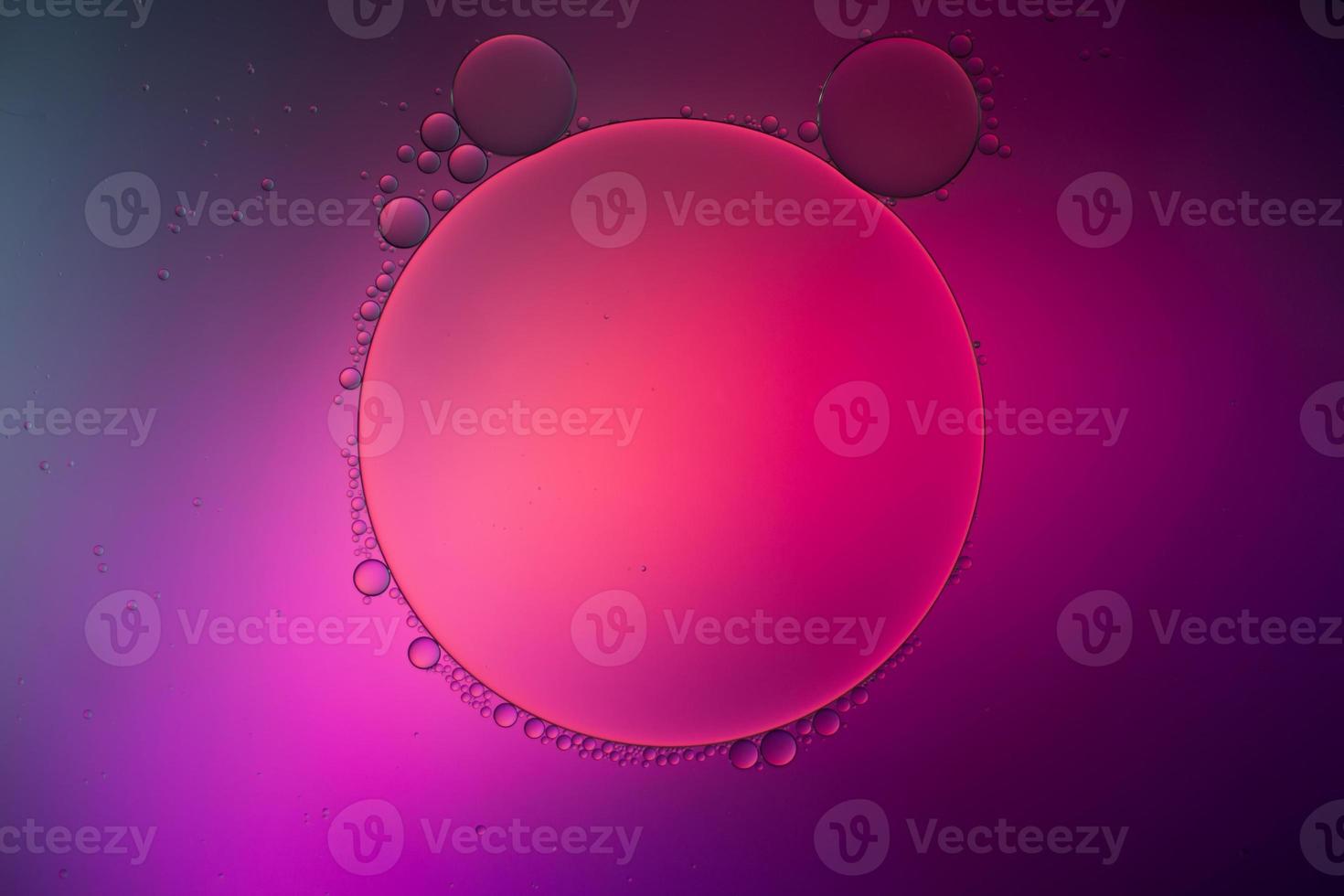 Colorful artistic of oil drop floating on the water photo