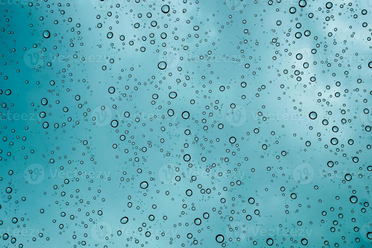 Drops of water on the windshield of the car in heavy rain. water drop backgrond. photo