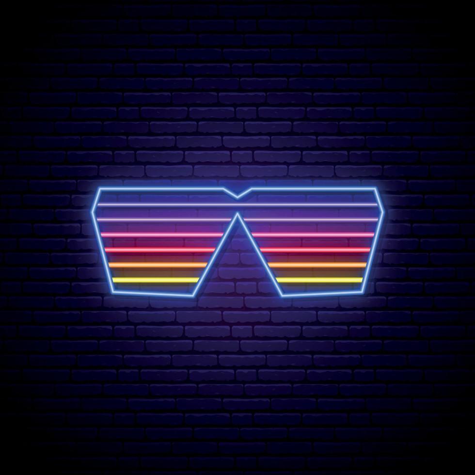 Neon shutter glasses sign. Glowing sunglasses emblem on dark brick wall