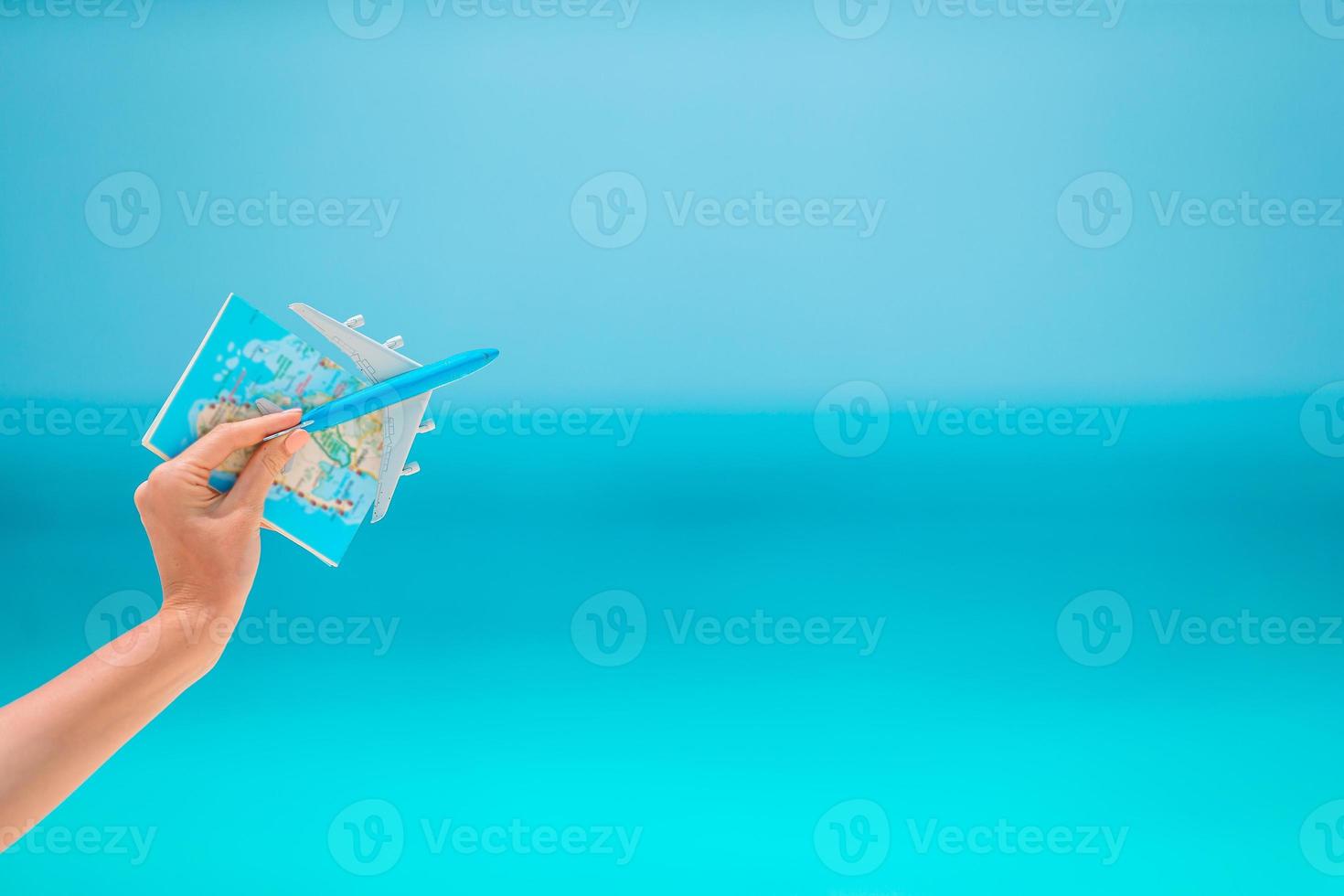Closeup of map and model airplane background the sea photo