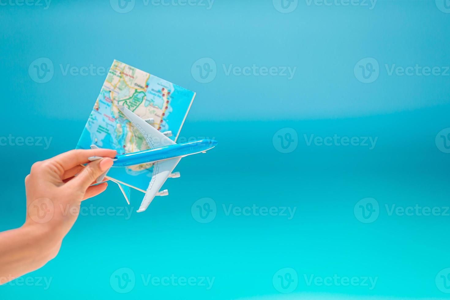 Closeup of map and model airplane background the sea photo