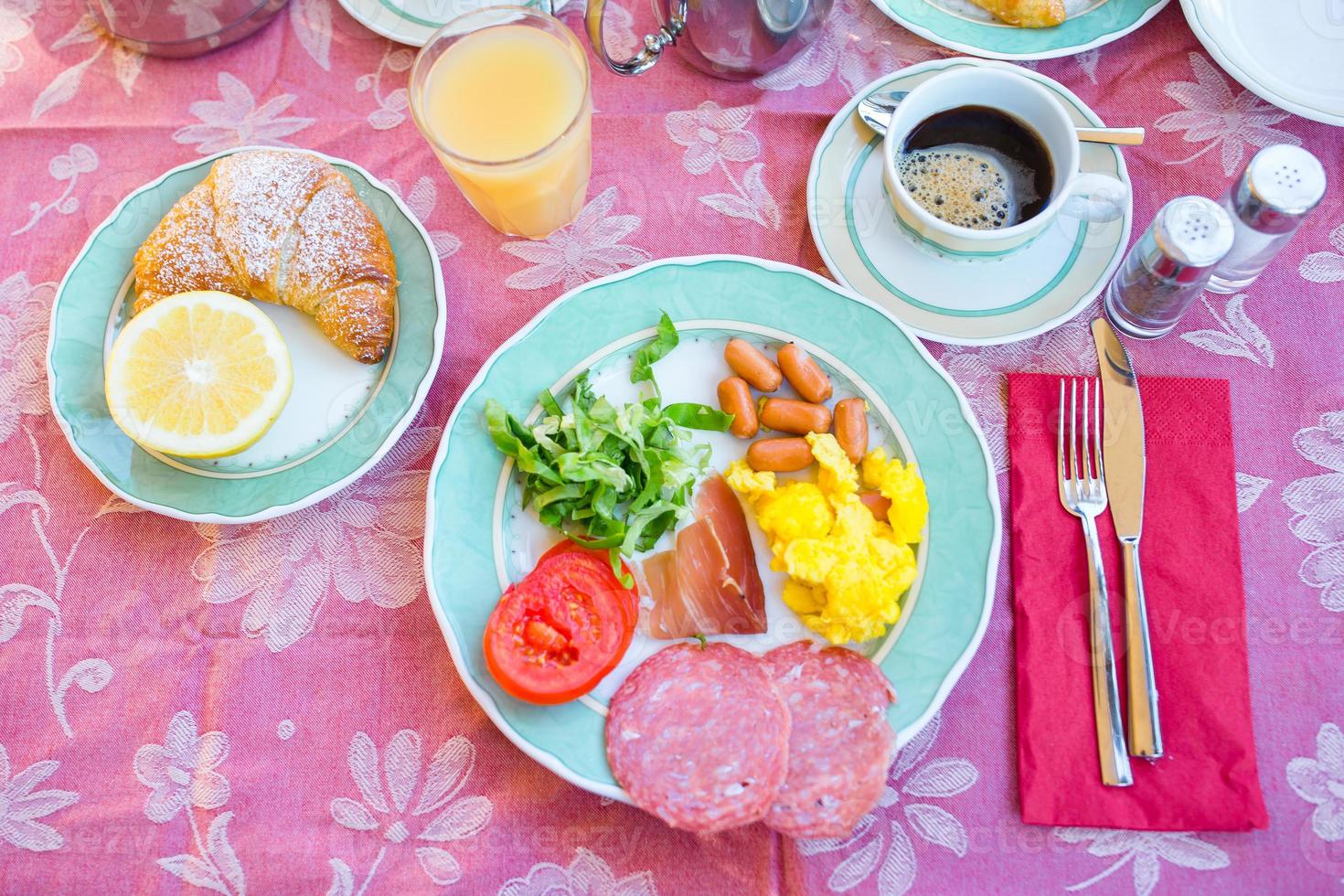 Tasty traditional appetizing yummy breakfast at the restaraunt outdoors. Fresh coffee and croissant photo