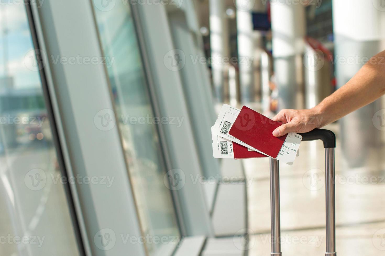 Closeup passports and boarding pass at airport indoor photo