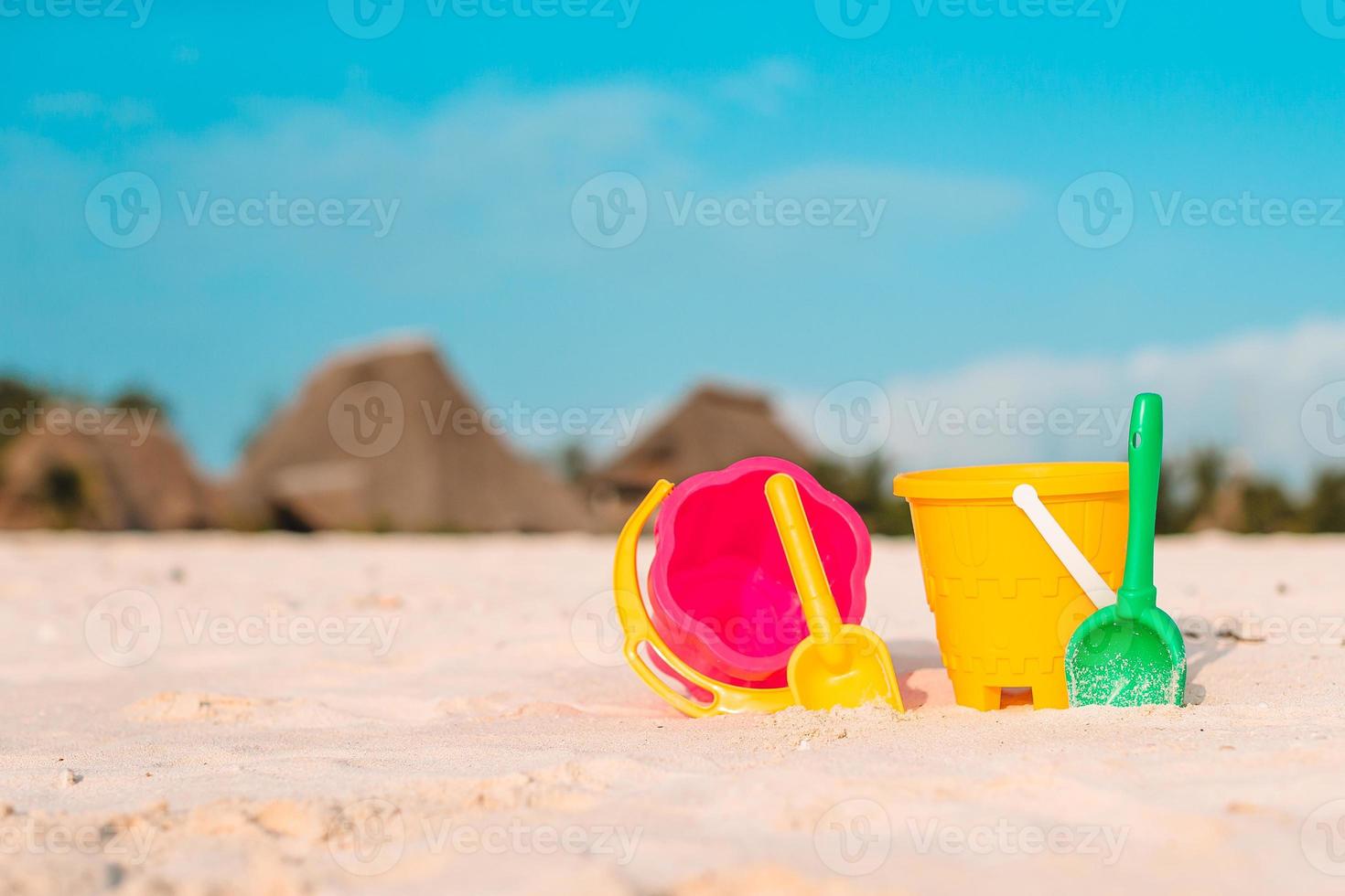 Beach kid's toys on white sand beach photo