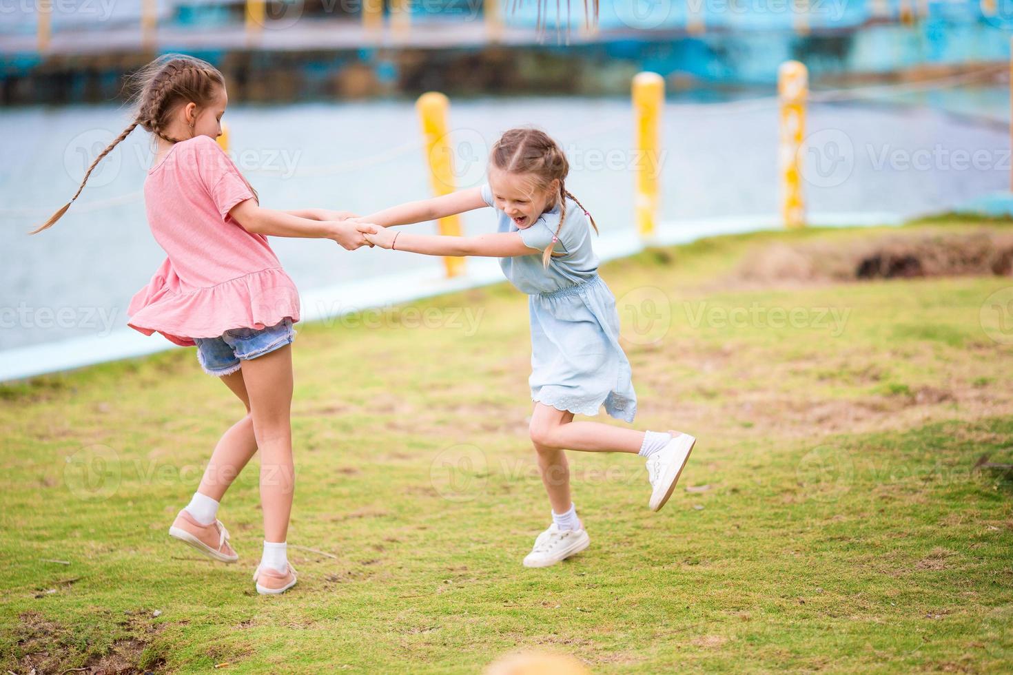 Adorable little girl have a lot of fun on summer vacation photo