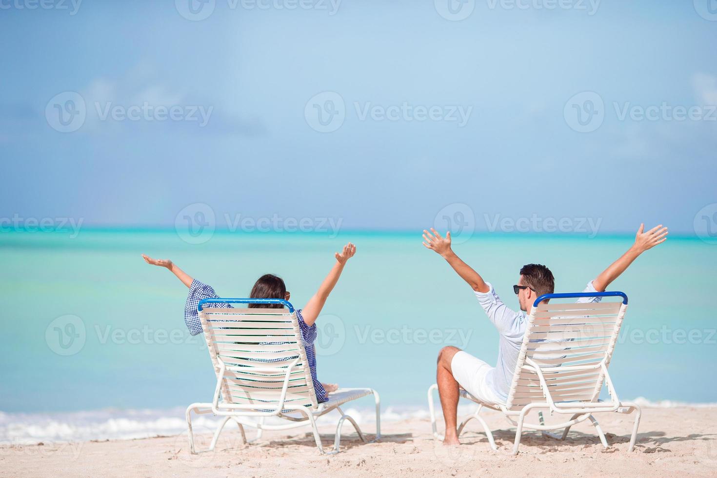 Couple relax on a tropical beach at Maldives photo