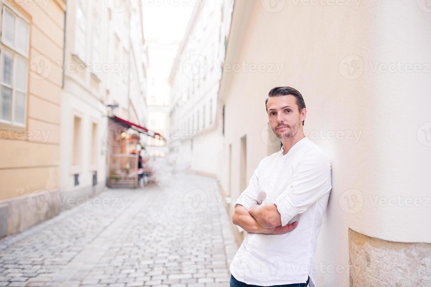 Young man background the old european city take selfie photo