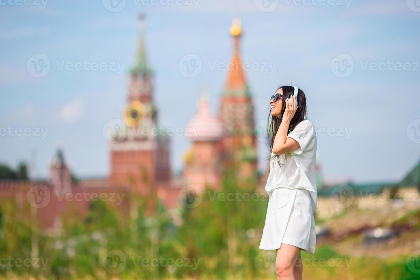 Happy young urban woman in european city. photo