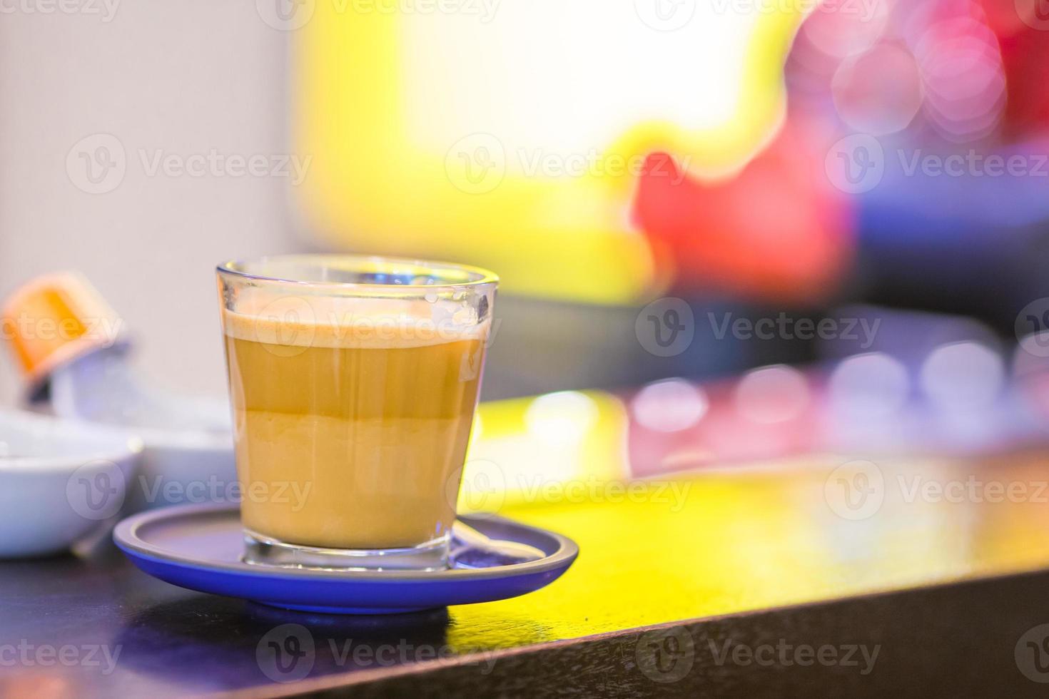 Cup of coffee on bar counter in the store photo