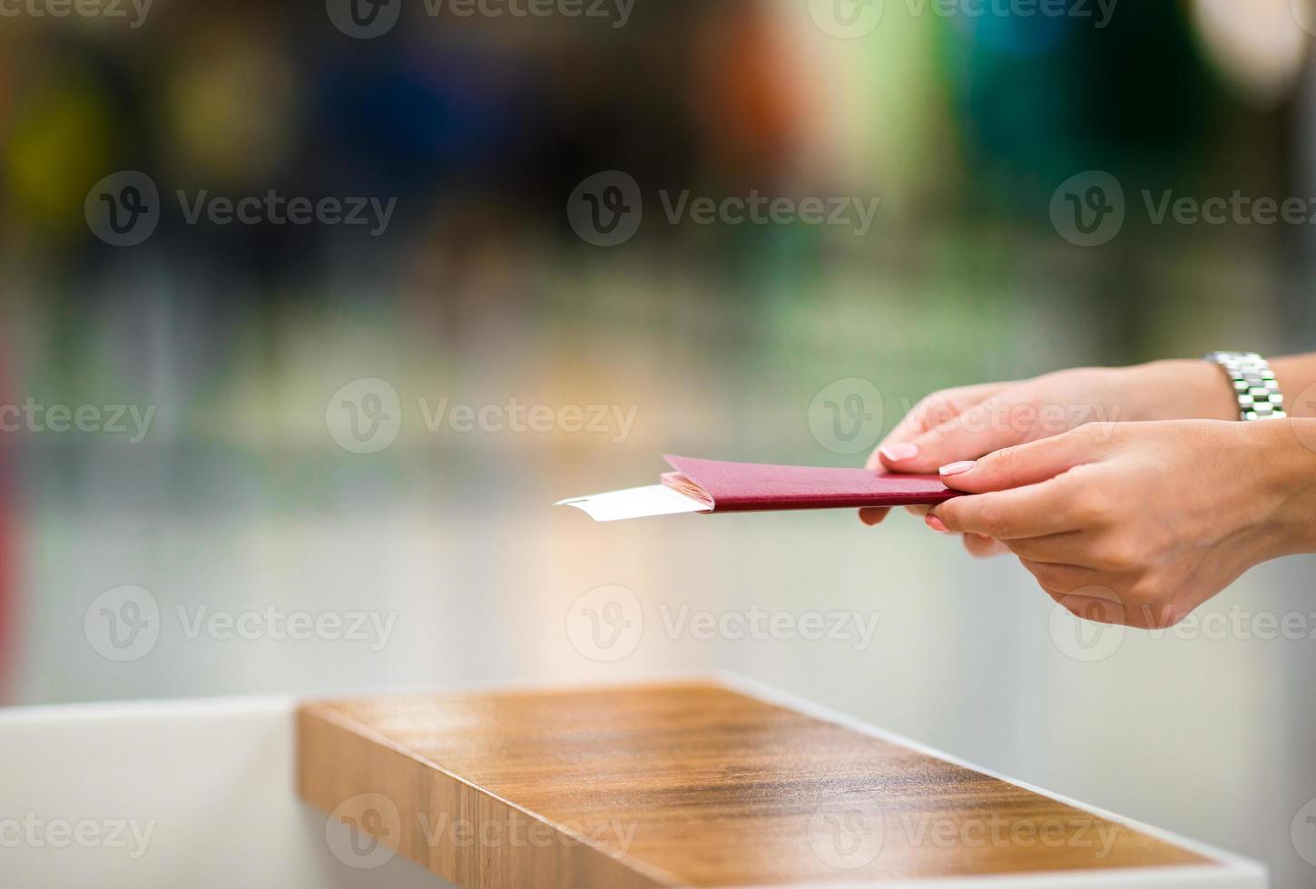 Closeup passports and boarding pass at airport indoor photo