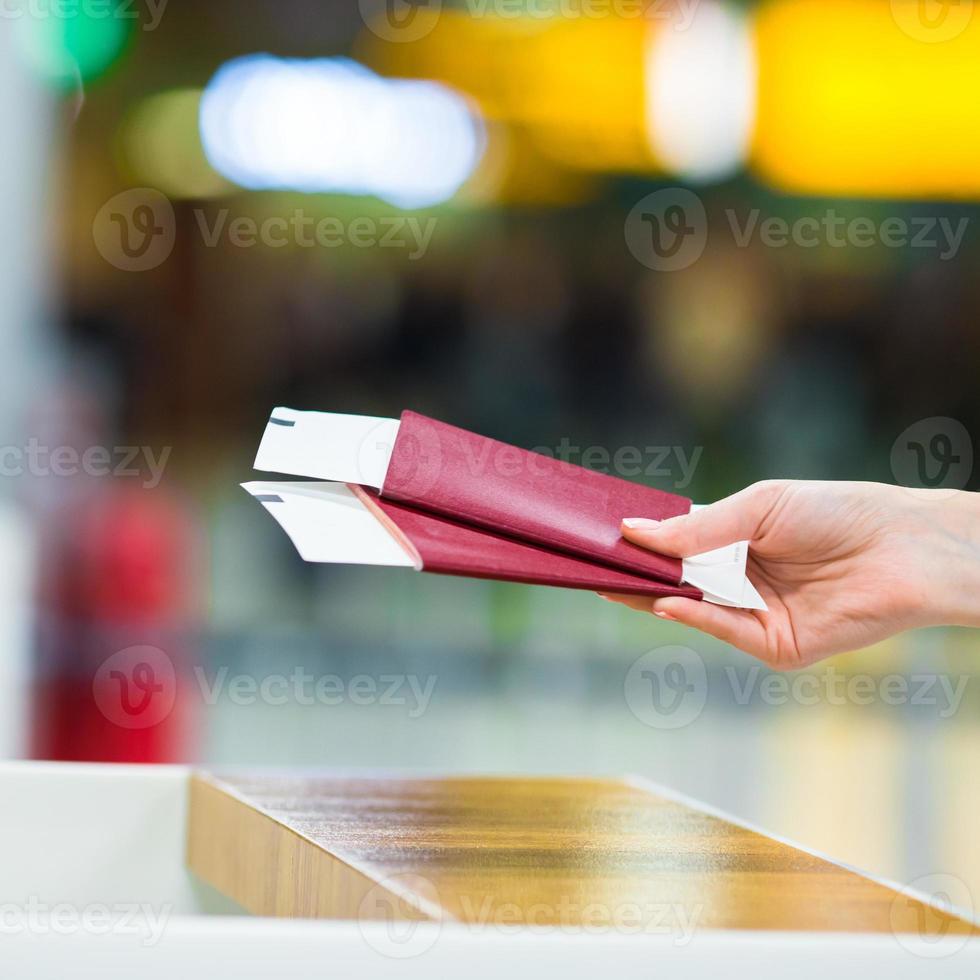 Closeup passports and boarding pass at airport indoor photo