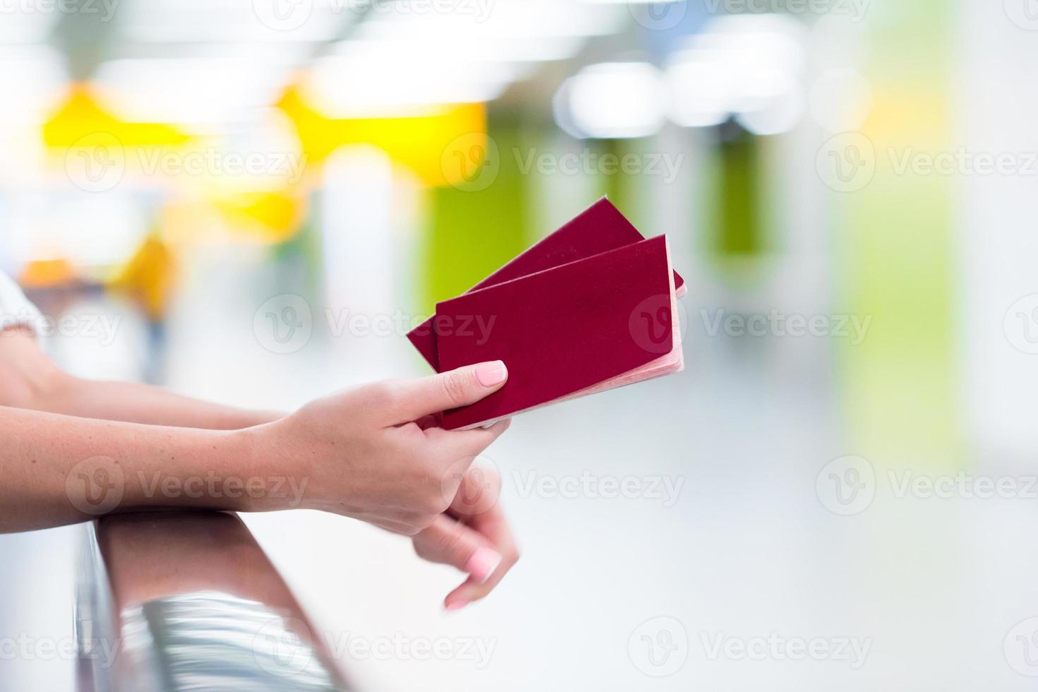 Closeup passports and boarding pass at airport indoor photo