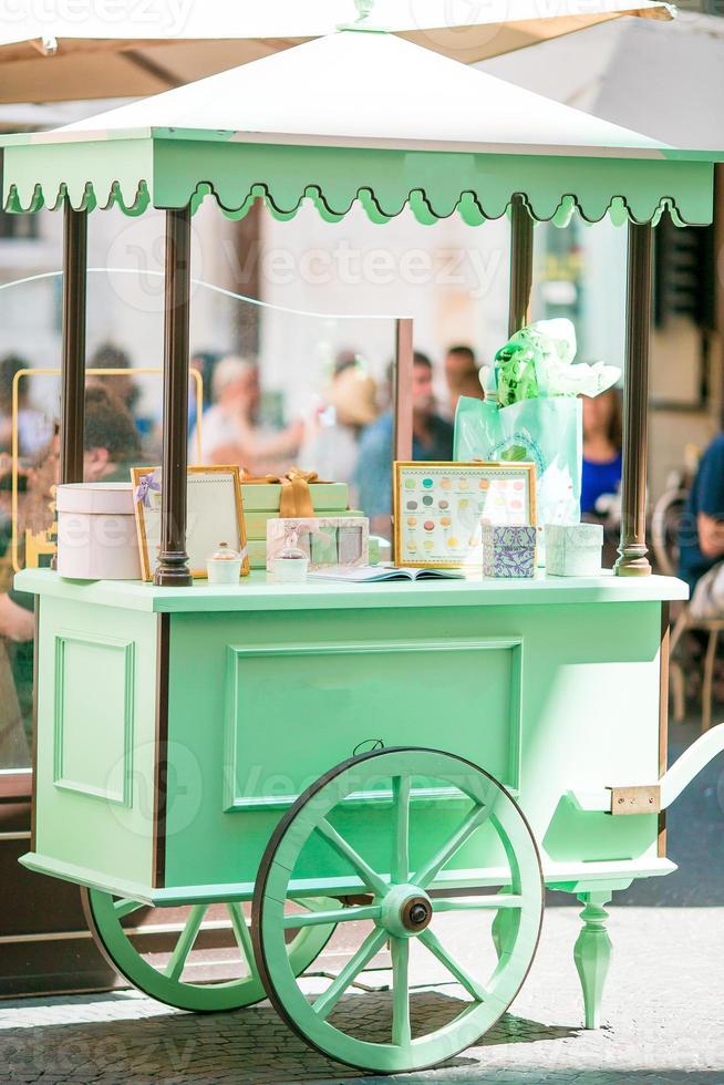 Shiny mint colorful ice cream cart outdoors photo