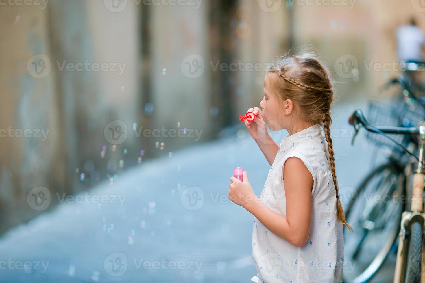 Adorable fashion little girl outdoors in European city Rome photo