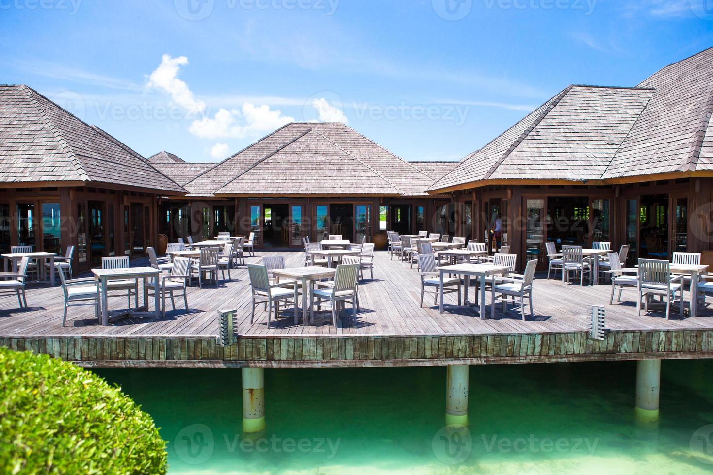 Summer empty outdoor cafe on shore at exotic island in indian ocean photo