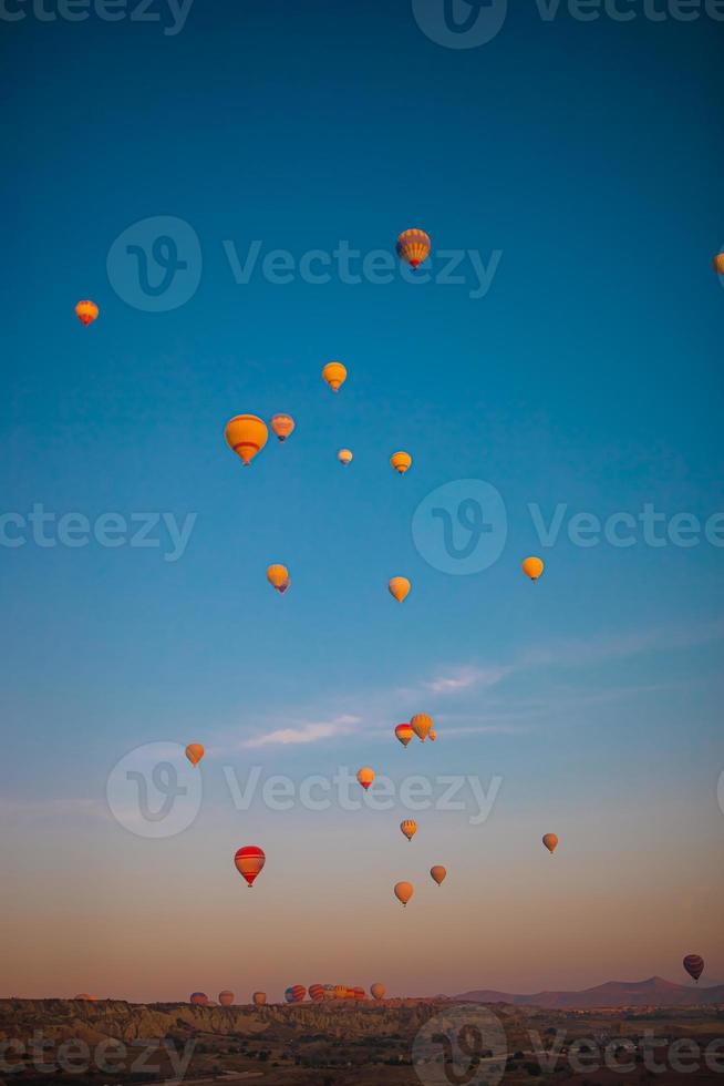 Bright hot air balloons in sky of Cappadocia, Turkey photo