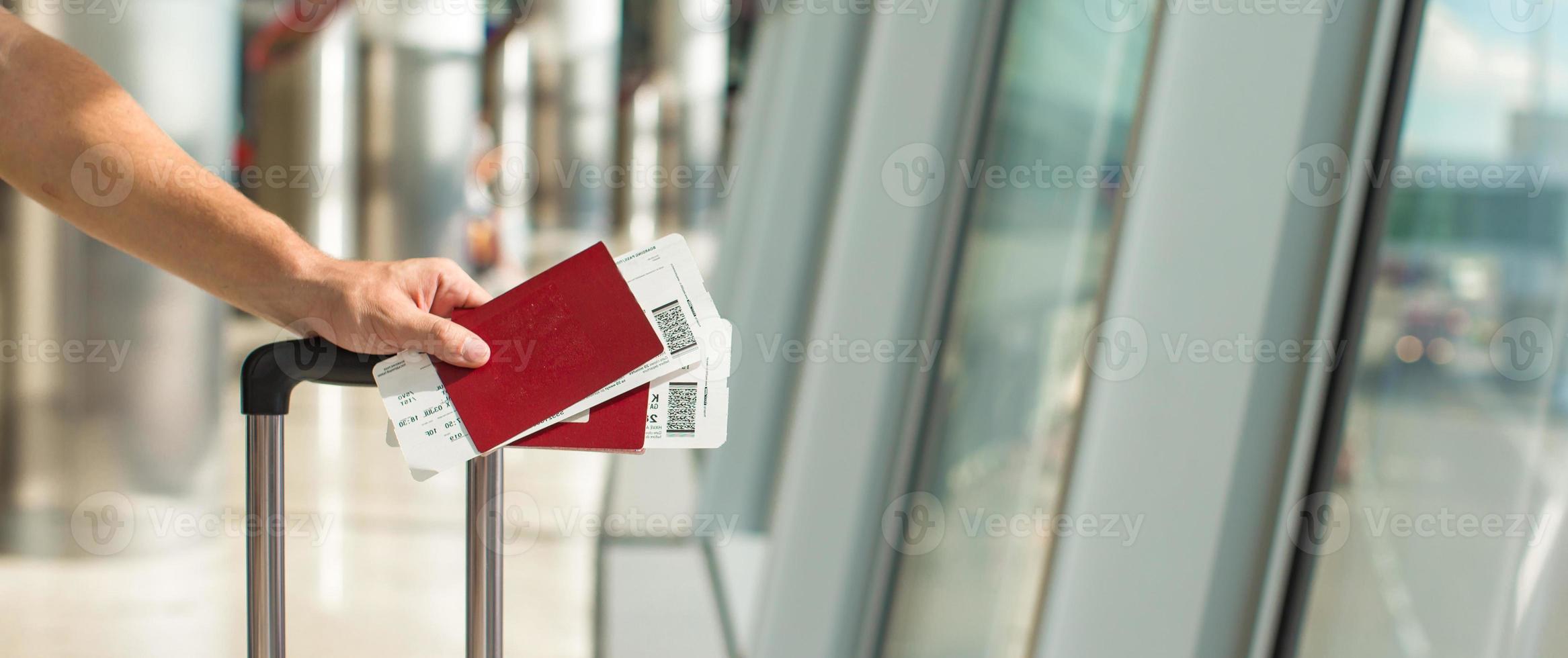 Closeup passports and boarding pass at airport indoor photo