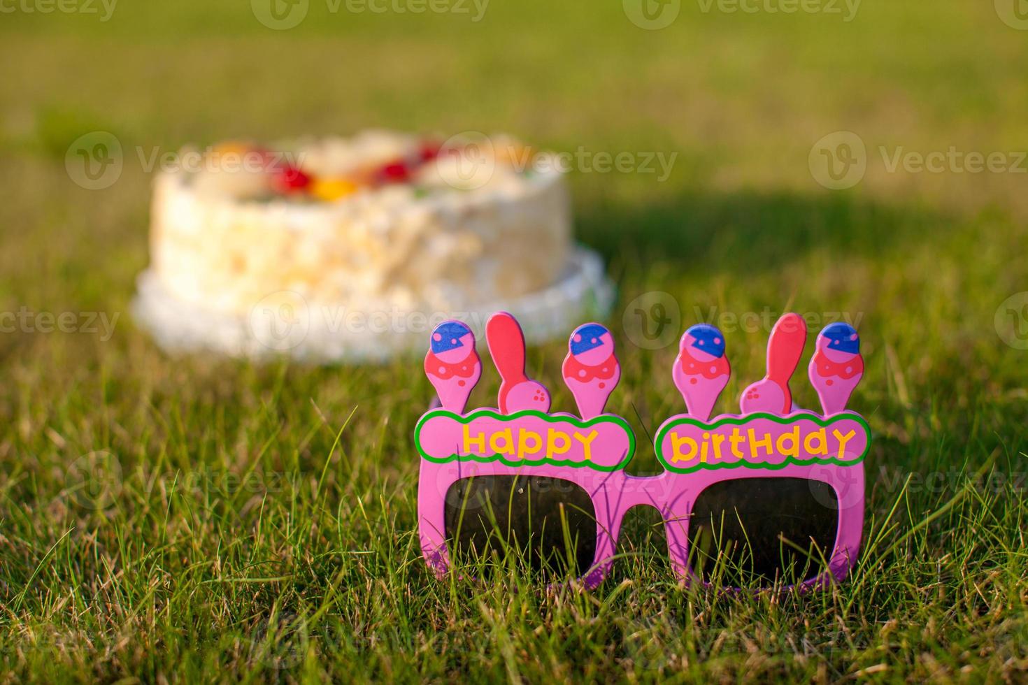 Celebratory cake and glasses that says a Happy Birthday photo