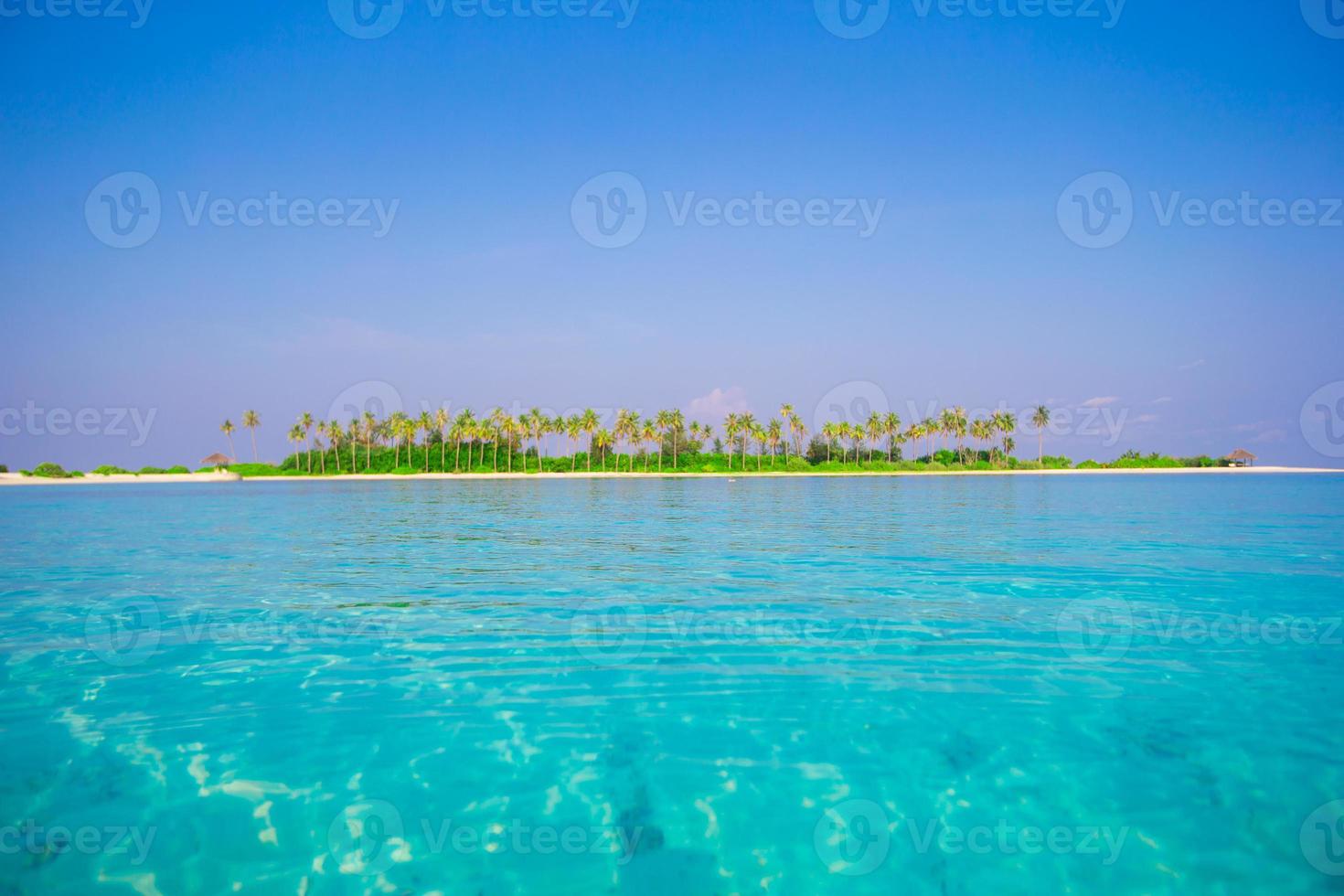 Beautiful white sand beach and Indian ocean photo