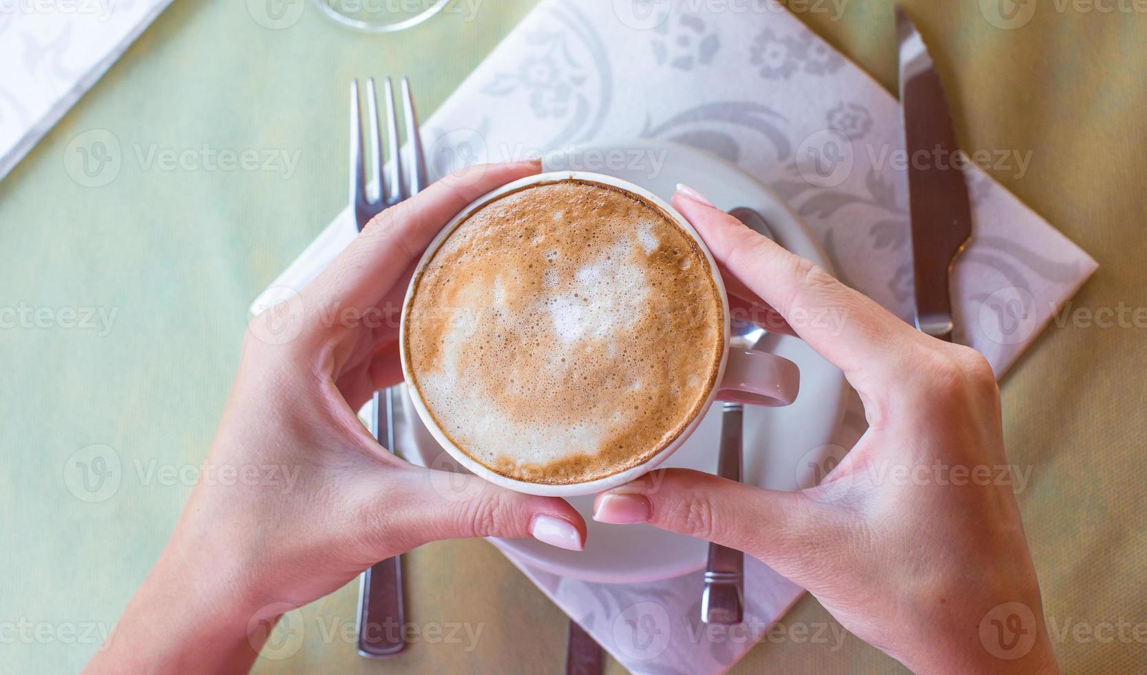 Delicious, aromatic cappuccino for breakfast at a cafe in the resort photo