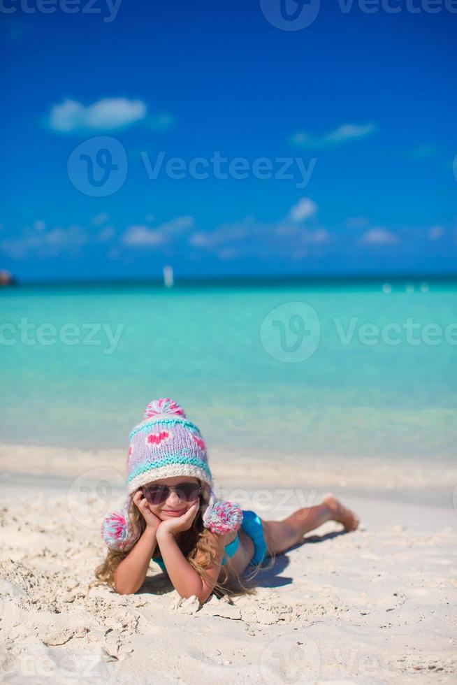 Portrait of adorable little girl on summer vacation at white beach photo