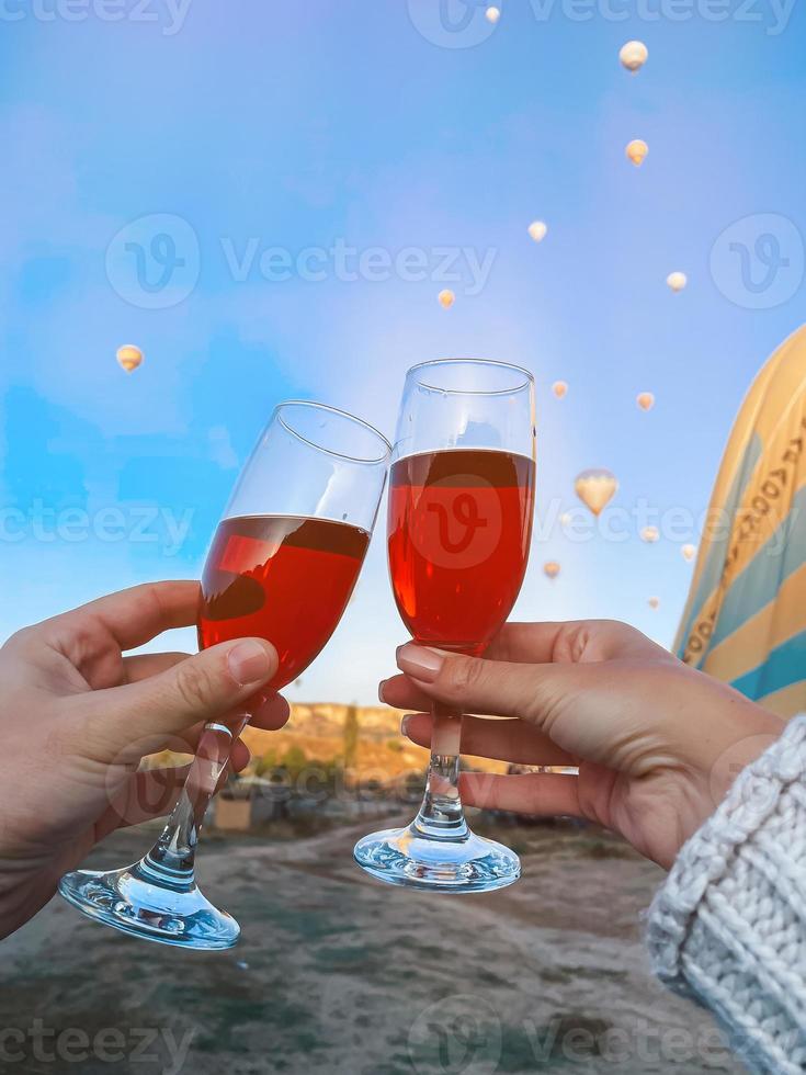 Hot air balloon flying over rocky landscapes in Cappadocia with beautiful sky on background photo