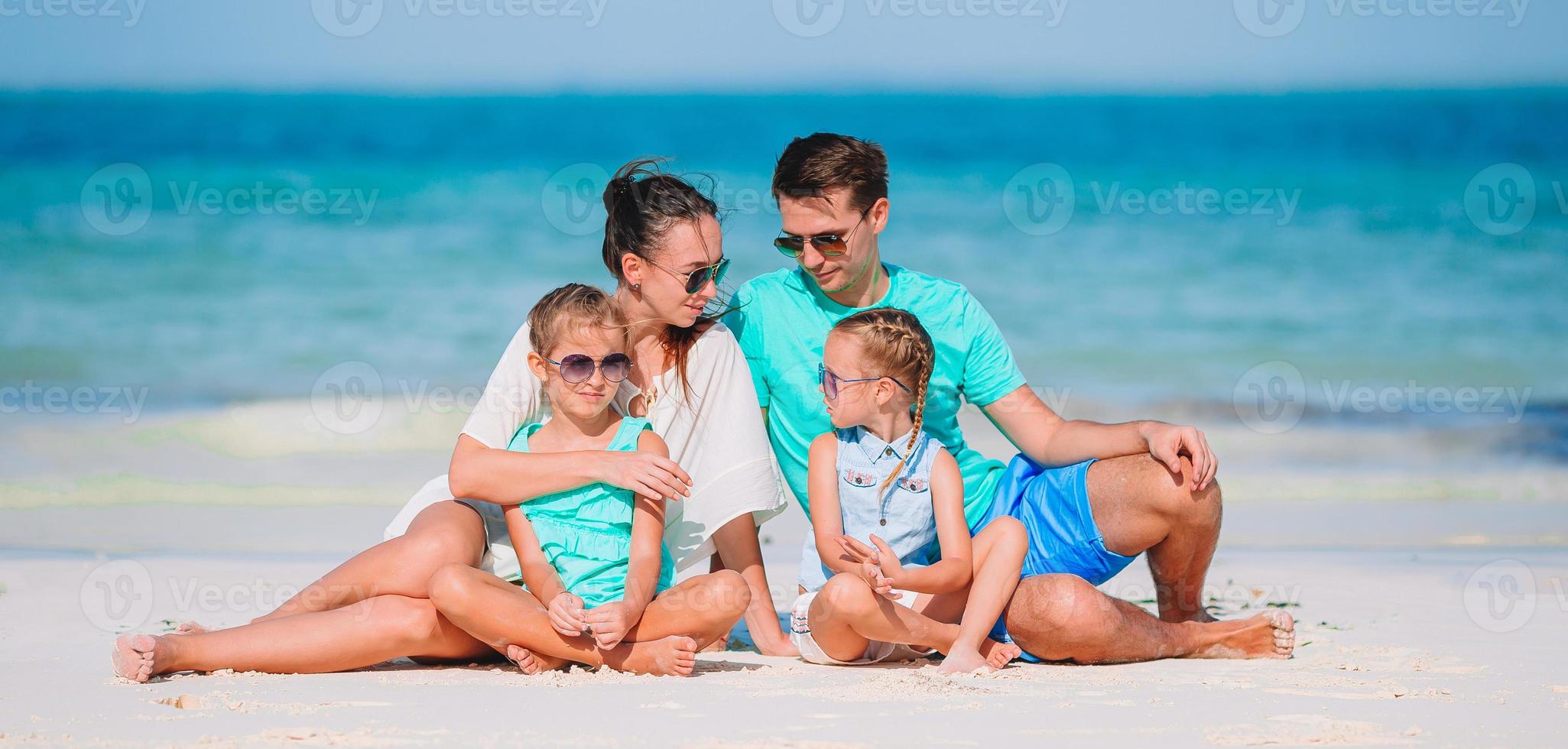 Young family on vacation on the beach photo