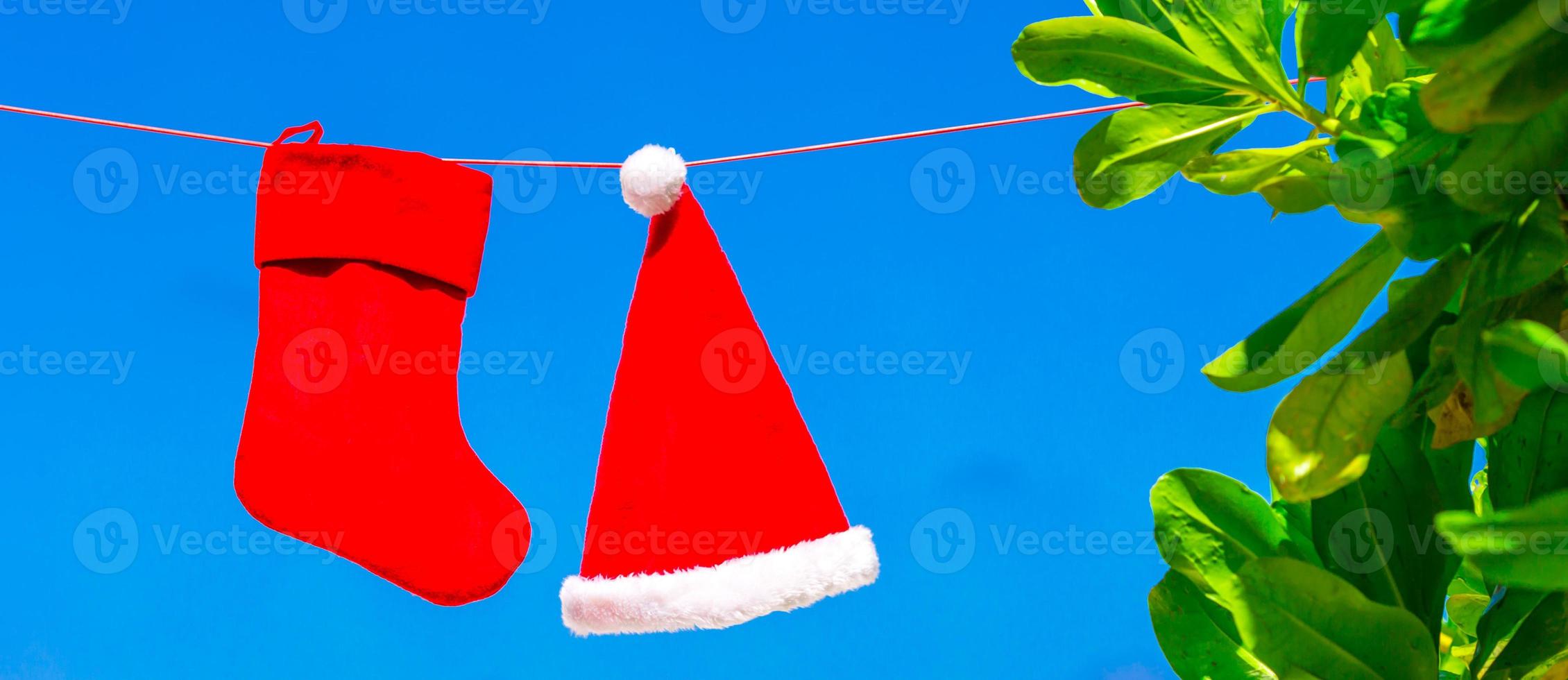 Christmas concept santa hat and stocking background blue sky photo