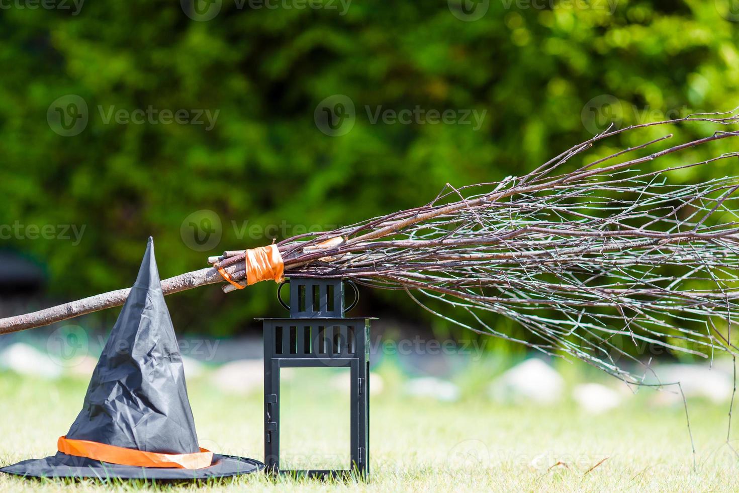 Halloween accessories hat, broom, candle, garlic and flashlights.Trick or treat photo