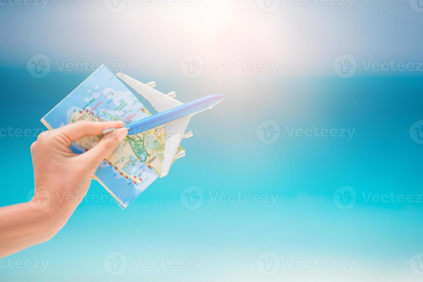 Closeup of map and model airplane background the sea photo