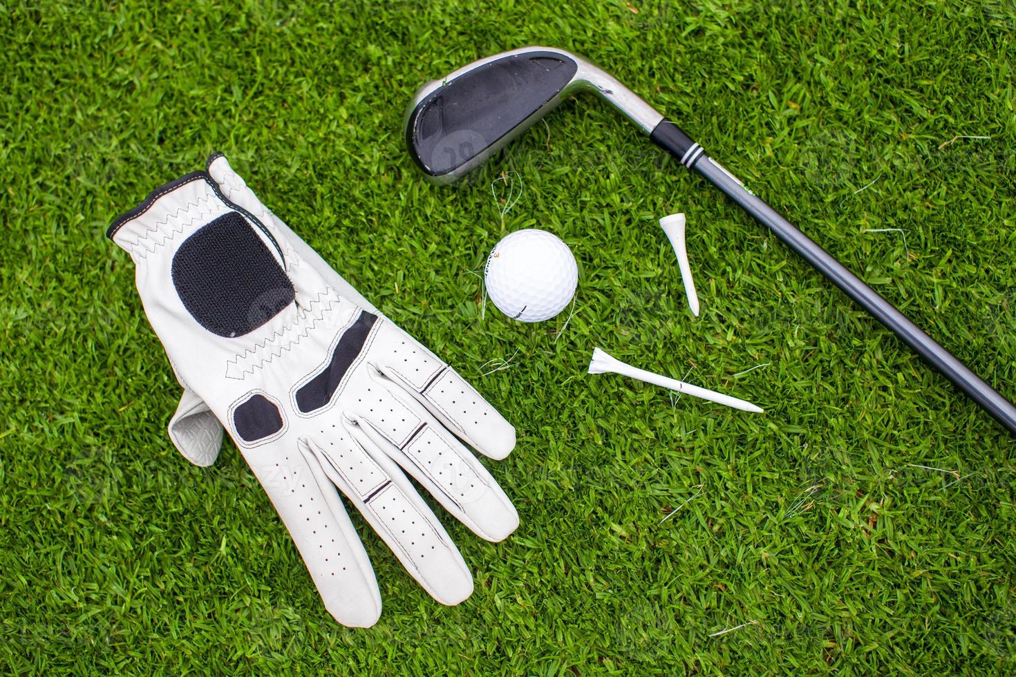 Golf equipment on green grass photo