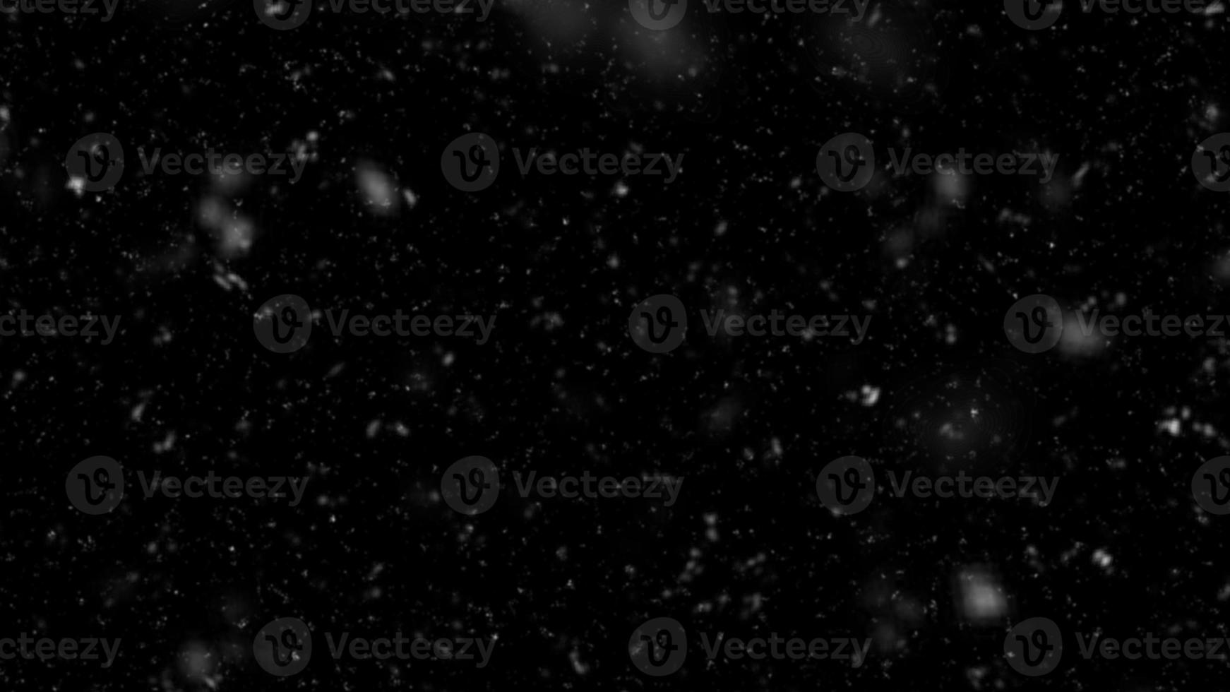 Falling snow isolated on black background. Falling snow at night. Bokeh lights on black background, flying snowflakes in the air. Winter weather. Overlay texture photo