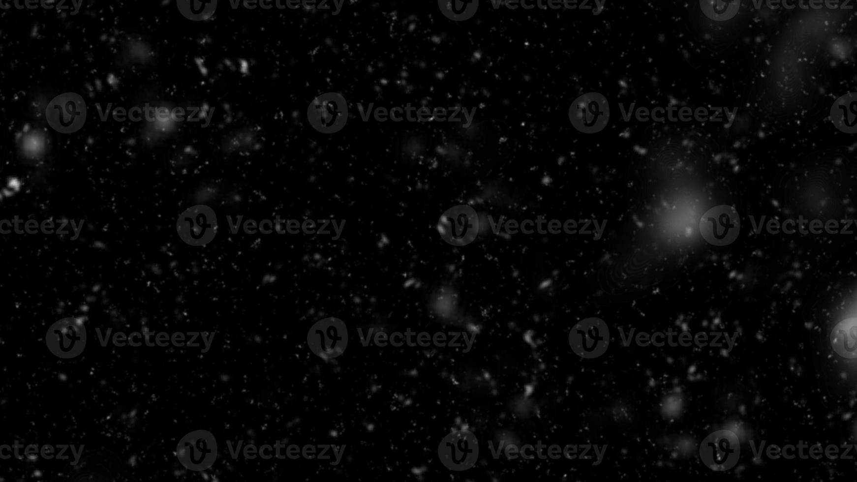 Snowfall bokeh on black background. Many snowflakes in flying in the air. Winte night snowfall and blizzard of snow at. Blur bokeh light effect creative background. photo