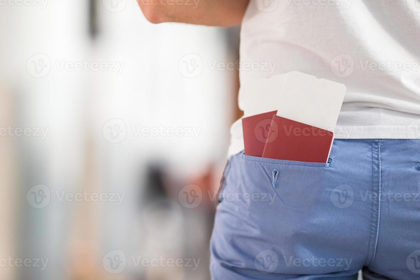 Closeup passports and boarding pass at airport indoor background airplane photo