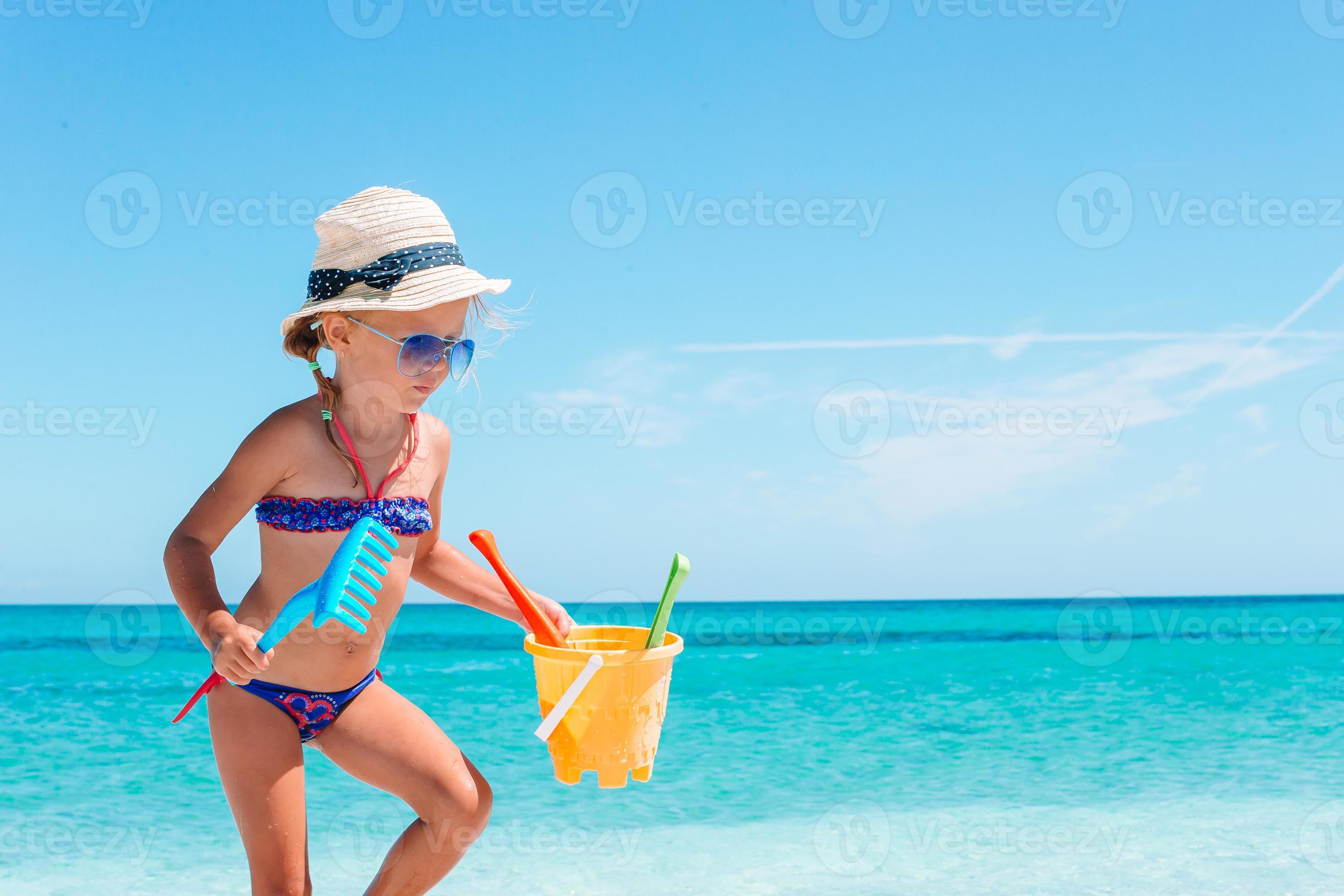 Beautiful little girl at beach having fun. Funny girl enjoy summer vacation.  18108615 Stock Photo at Vecteezy