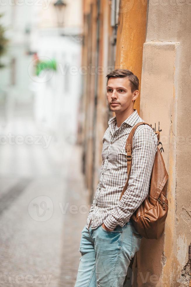 Carefree young man searching for place of destination photo