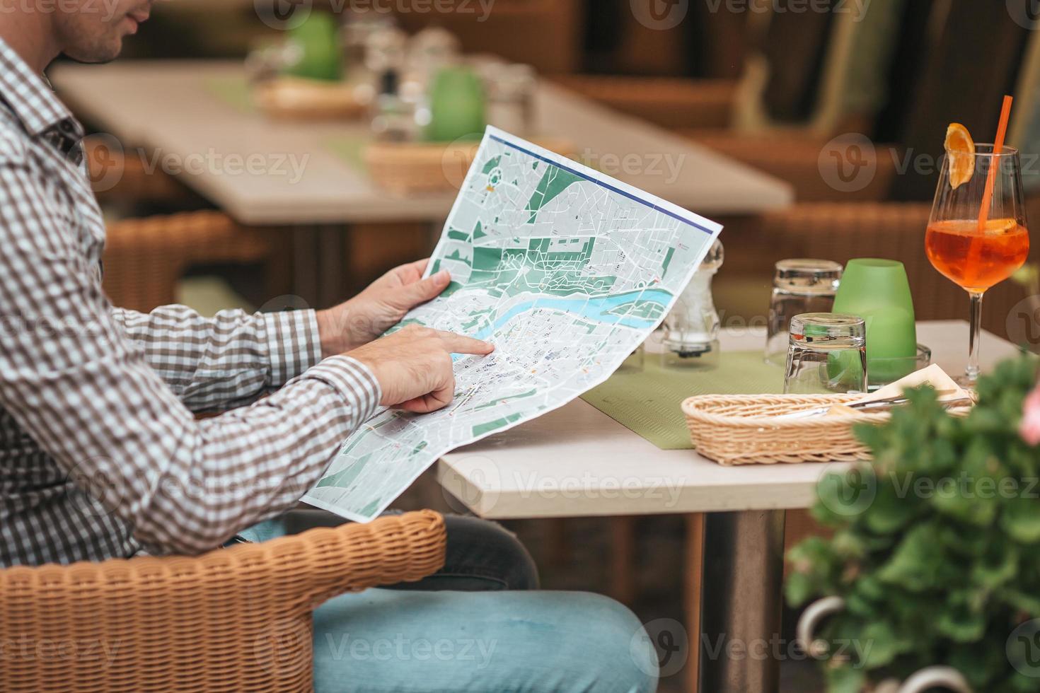 Carefree young man searching for place of destination photo