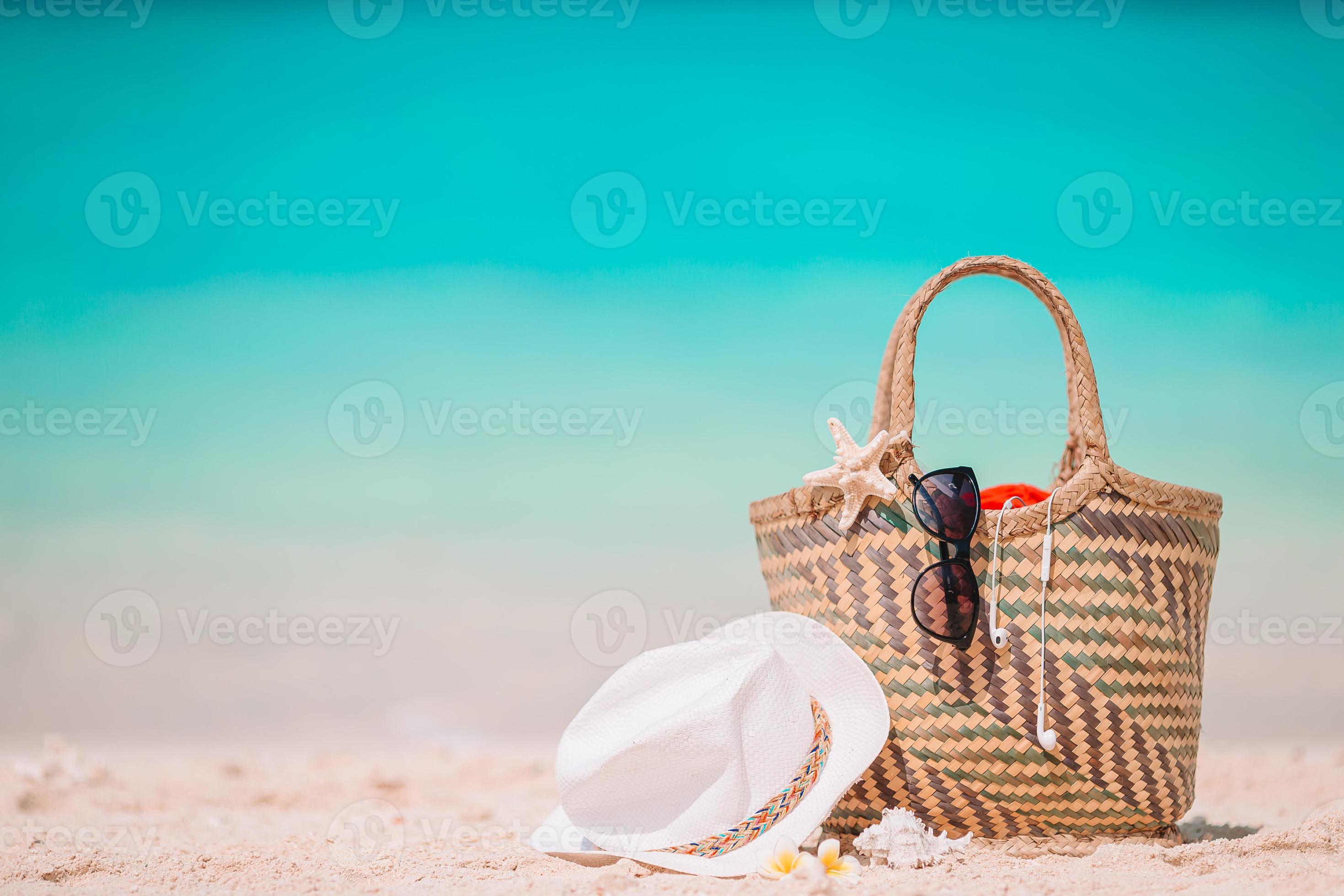 Beach accessories straw bag, hat and unglasses on the beach 18109860