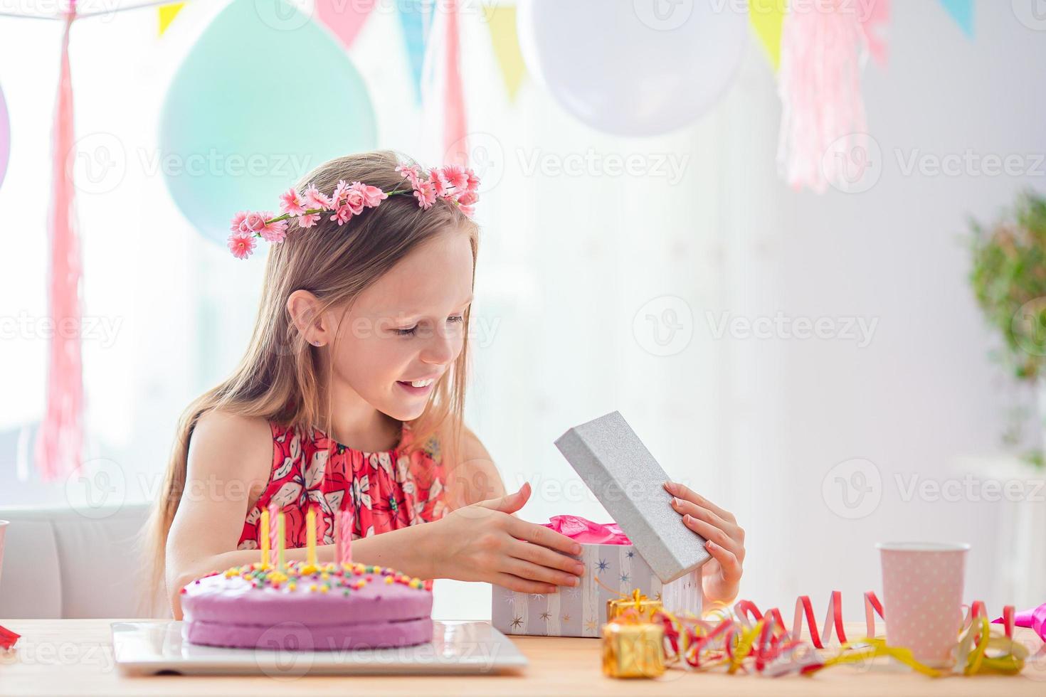 Caucasian girl at birthday. Festive colorful background with balloons. Birthday party and wishes concept. photo