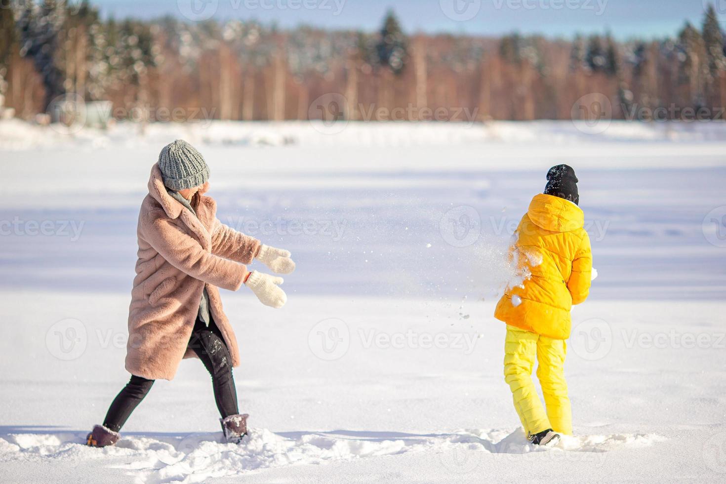 Family of mom and kid vacation on Christmas eve outdoors photo