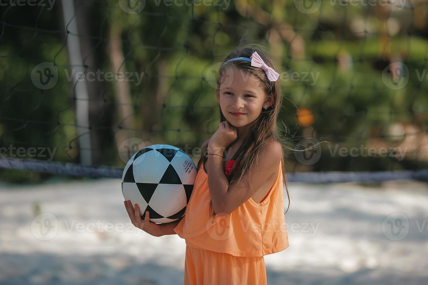 Cute little girl at beach during caribbean vacation photo