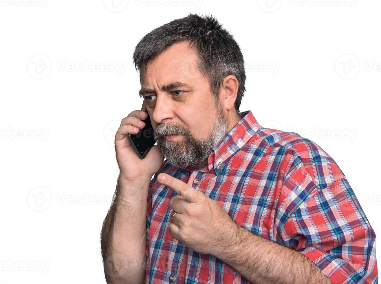 Middle-aged man speaks on a mobile phone photo